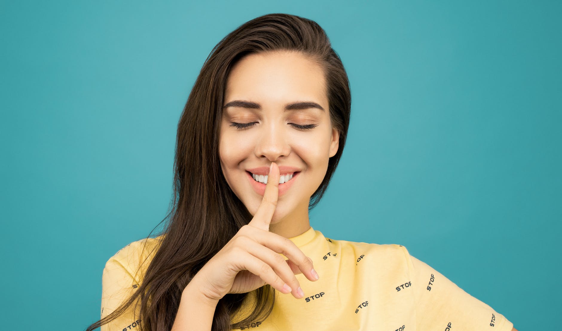 close up photo of woman in yellow shirt